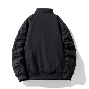 Back view of minimalist men's black windproof baseball jacket with ribbed knit cuffs and hem