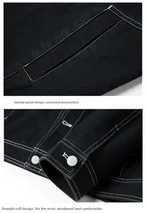 Detail view of black denim jacket with contrast stitching pockets and round button cuffs