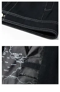 Detail of black denim jacket featuring contrast stitching and map print inner lining
