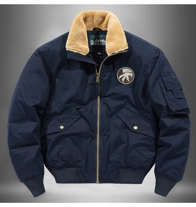 Detailed view of navy pilot jacket with beige sherpa collar and metal zipper detail