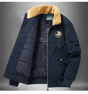 Detail of navy pilot jacket showing beige faux fur collar and interior graphic lining