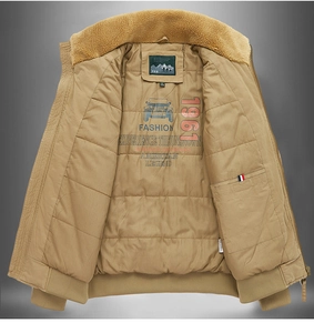 Detailed view of the quilted inner lining with vintage American jeep graphic on khaki jacket