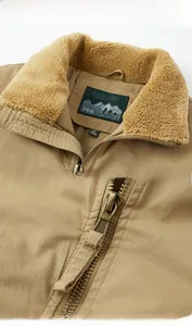 Close-up of khaki jacket featuring warm lamb wool collar and durable bronze metal zipper