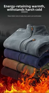 Detail of four men's fleece jackets stacked showing soft polar fleece texture and colors