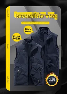 Detail view of reversible navy blue vest showing fleece lining and multi-pocket windproof side