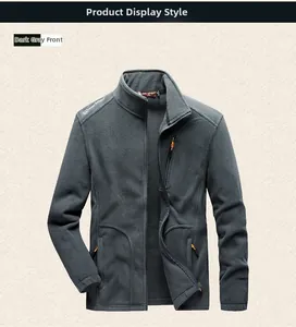 Detailed view of dark grey fleece vest with standing collar and orange zipper pulls