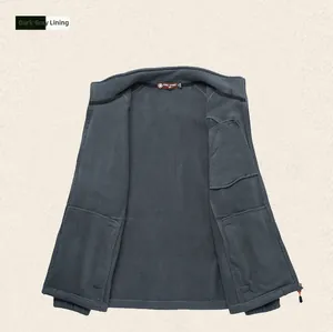 Detail view of dark grey polar fleece liner jacket with stand collar and soft inner texture
