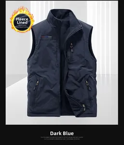 Detail of dark blue outdoor vest featuring fleece lining and functional zipper pockets