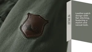 Detail of army green cotton jacket with mountain logo embossed on brown leather patch