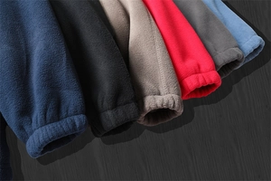 Detail of elastic cuffs on thick fleece hoodies in six various vibrant colors