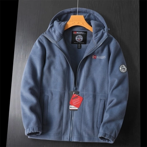 Detail view of navy fleece jacket with Norway flag patch and drawstring hood