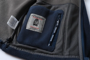 Macro view of warm winter fleece jacket with inner zipper pocket and mesh lining detail