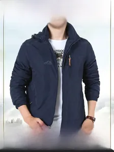 Detail of navy blue hooded jacket with outdoor chest embroidery and adjustable Velcro cuffs