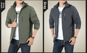 Detail view of army green and grey outdoor hooded jackets with windproof fabric