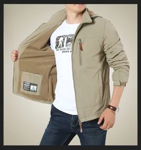 Detail of khaki outdoor jacket showing warm brown fleece lining and zipper closure