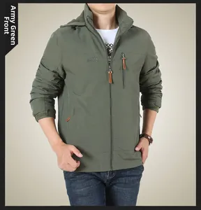 Detail of army green outdoor jacket featuring chest zipper pocket and mountain embroidery