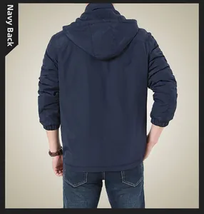 Detail view of navy blue hooded jacket back showing elastic cuffs and windproof fabric