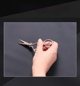 Close-up of scratch-resistant fabric being tested with scissors for durability