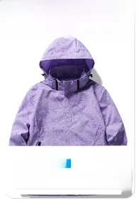 Detail view of purple waterproof camo jacket showing tropical leaf patterns and hood
