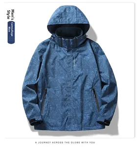 Detail of blue camouflage waterproof outdoor jacket with zipper pocket and hood