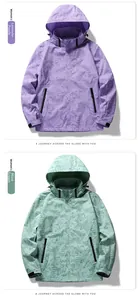 Detail of hooded windproof jackets with leaf pattern in lavender and sage green colors