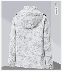 Women's 3-in-1 waterproof jacket detail in lily white with tropical leaf print