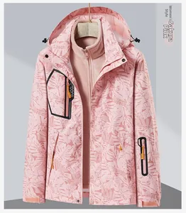 Close-up of women's 3-in-1 cherry blossom pink outdoor jacket with palm leaf pattern