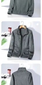 Detail view of dark grey polar fleece jacket showing standing collar and thermal lining