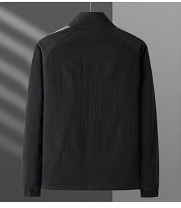Detail view showing back of black windproof sports jacket with raglan sleeves and stand collar