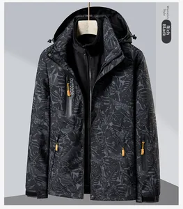 Detail view of women's 3-in-1 outdoor jacket with leaf pattern and orange zipper accents