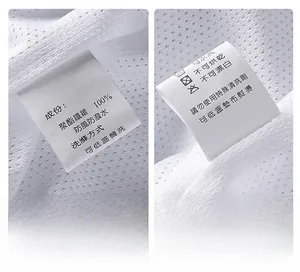 Close-up of white mesh lining and laundry care label showing 100% polyester fabric material
