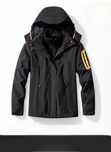 Détail de la veste d'extérieur noire avec fermetures éclair étanches orange vif et texture