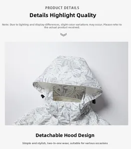 Detail view of the detachable hood design with tropical leaf print and toggle drawstrings