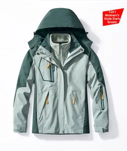 Detail of a dark green 3-in-1 waterproof women's outdoor jacket with gray fleece liner