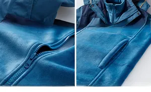 Détails de la capuche coupe-vent, du zip robuste et des poignets velcro de la veste polaire