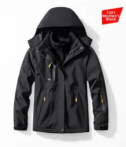 Detail of women's black waterproof jacket with orange zipper pulls and fleece lining