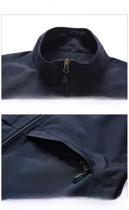 Close-up of navy blue outdoor vest featuring windproof stand collar and zipper pocket