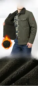 Detail of olive green cargo jacket with thick fleece lining and functional pockets