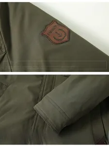 Detail showing military green jacket sleeve with vintage badge and embossed metal button