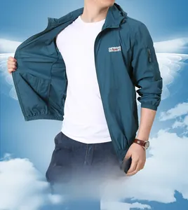 Detail of peacock blue outdoor sun protection jacket with hood and functional arm pocket