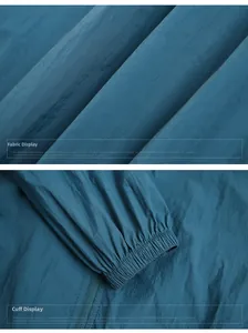 Detail of blue sun-protective jacket showing fabric texture and elastic cuff design