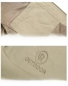 Detail of khaki outdoor vest showing mesh lining, inner pocket, and logo embroidery