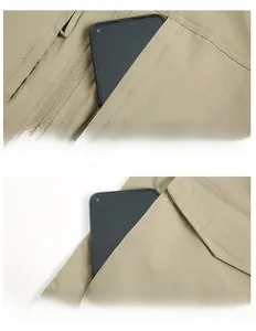 Detail view of khaki utility vest showing hidden zipper pockets and functional storage