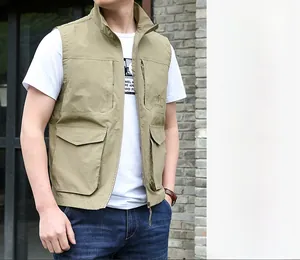 Close-up of functional multi-pocket design on men's khaki outdoor utility fishing vest