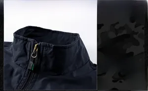 Detail of the stand-up collar and sports zipper on this blue outdoor utility vest