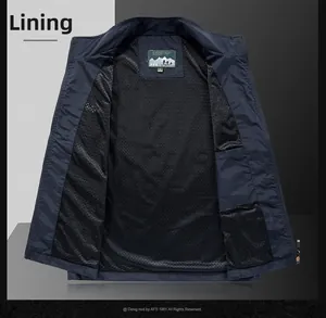 Detail of breathable black mesh lining and inner pocket on dark blue fishing vest