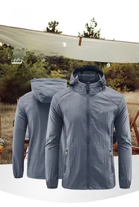 Detail of grey hooded sun protection jacket with outdoor lettering and zipper pocket