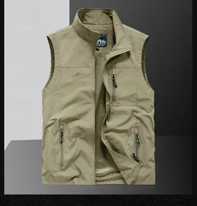 Detail view of khaki outdoor vest showing zipper pockets and breathable mesh lining