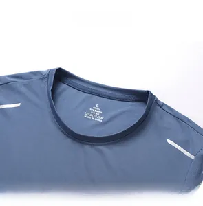 Detail of blue ice silk T-shirt neckline with breathable mesh fabric and size label