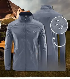 Macro shot of waterproof fabric on a men's gray-blue breathable summer sun protection jacket